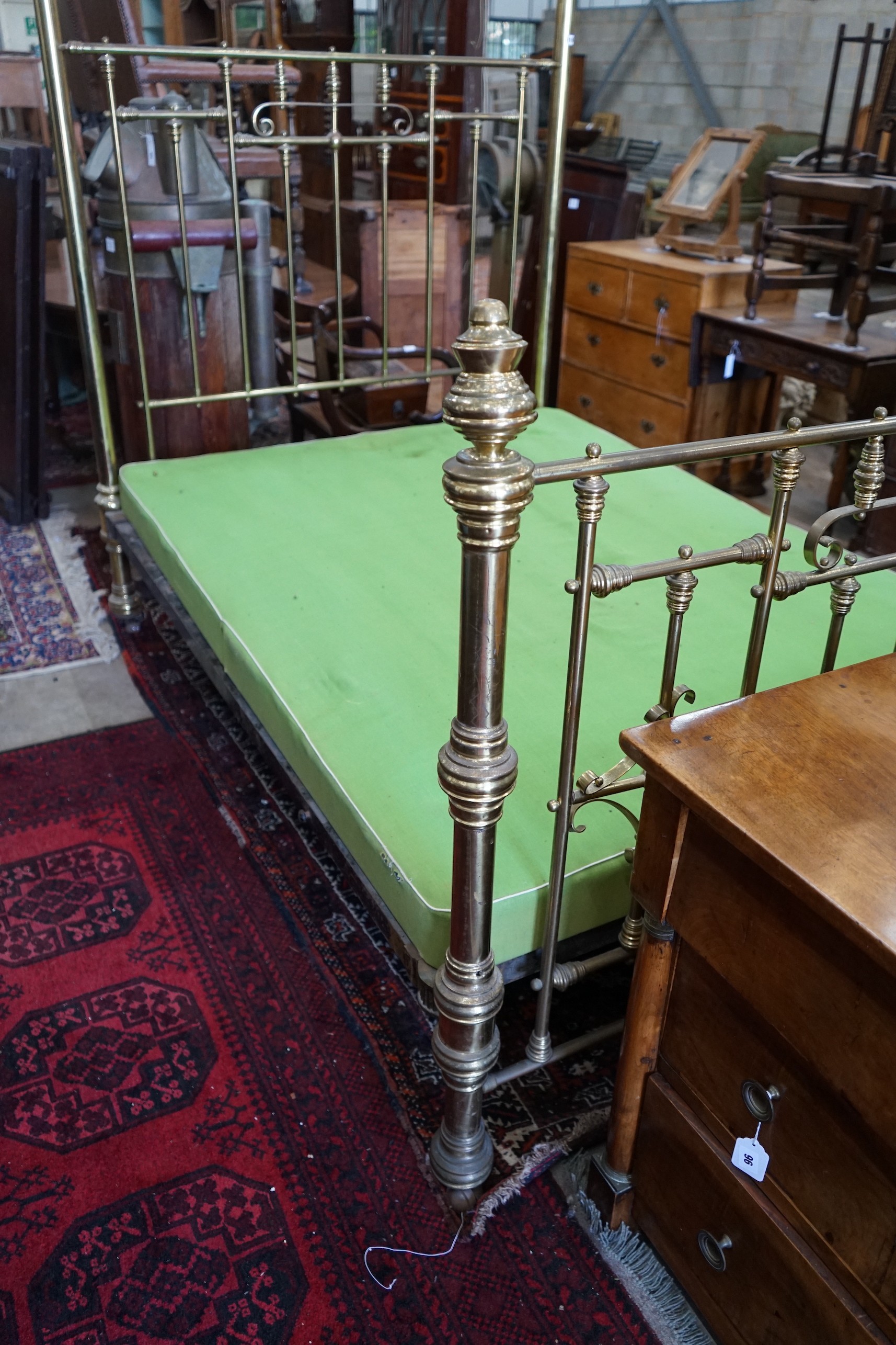 A Victorian brass half tester bedstead, width 140cm, length 200cm, height 230cm